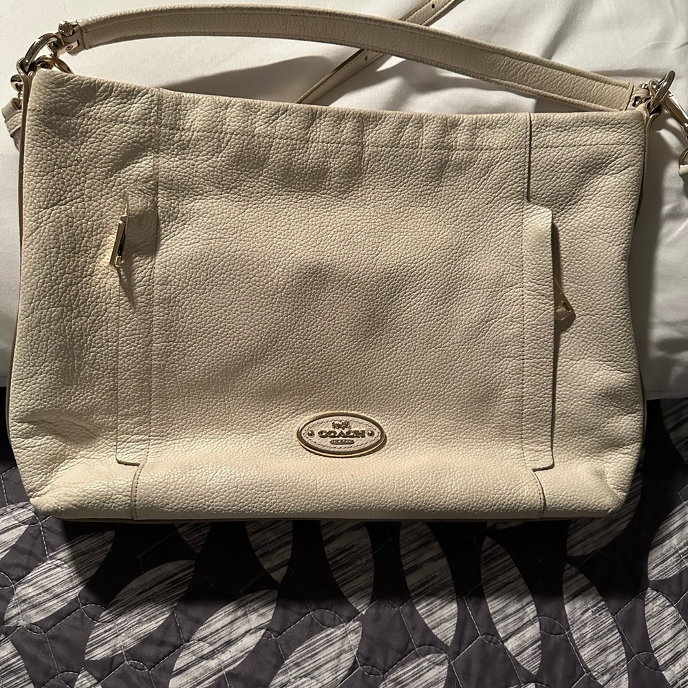 Cream colored leather Coach handbag. Excellent condition.